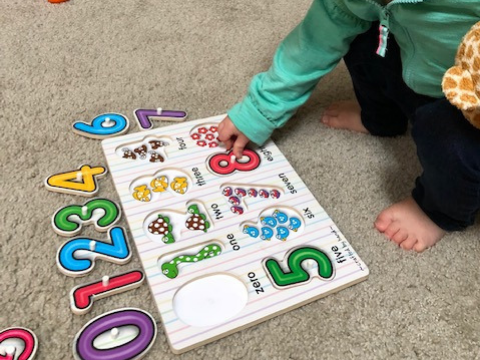 toddler cognitive development with number puzzles