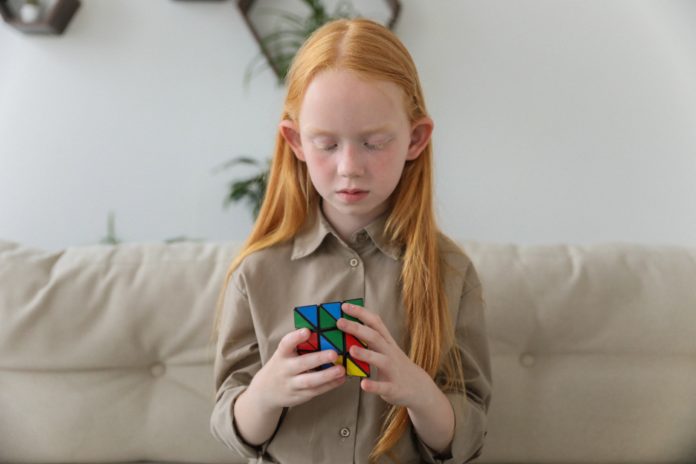 girl with rubix cube